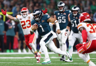 Jalen Hurts walking off the field after Super Bowl LVII